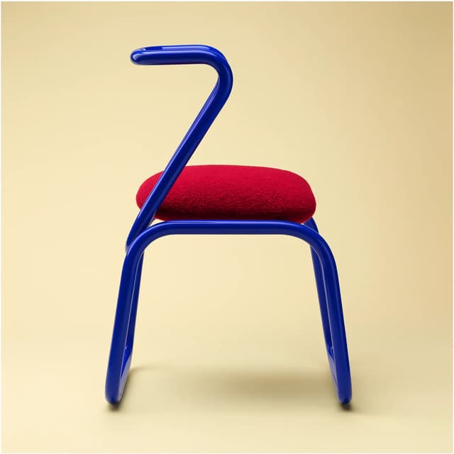 FLUX 3 example — blue tubular chair with red cushion, product design render