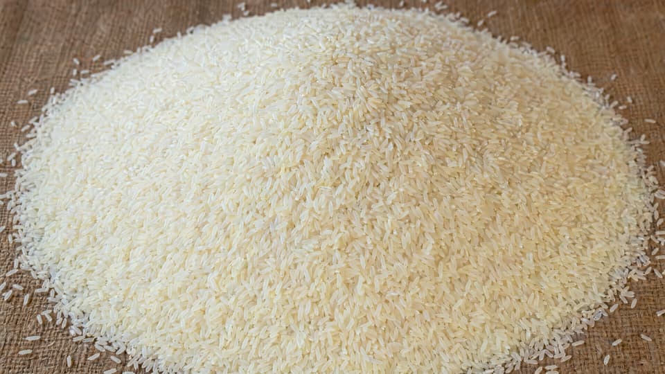 GPT Image 2 official sample — mound of rice with 'GPT Image 2' etched onto a single hidden grain, precision instruction following